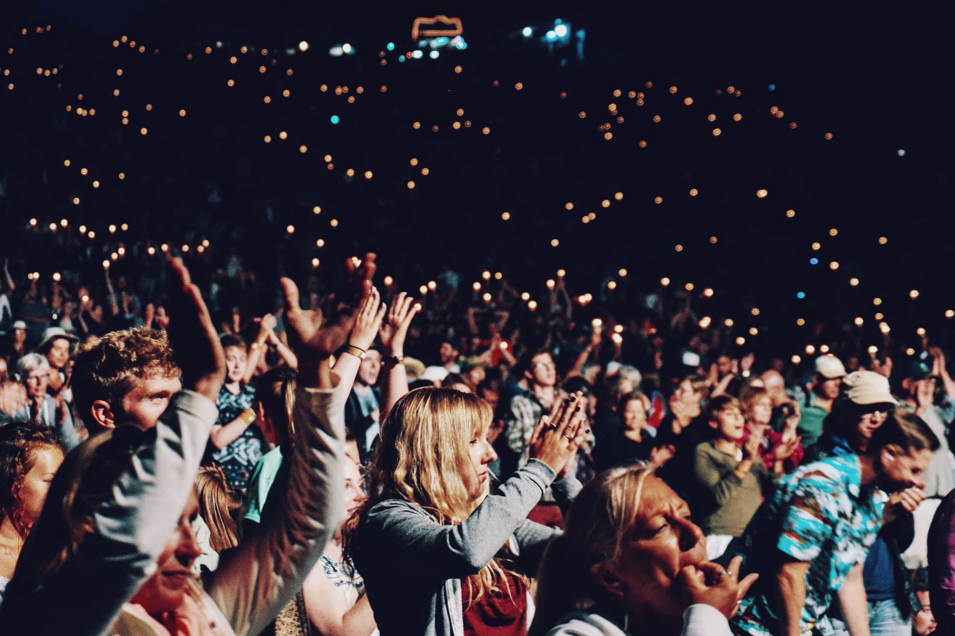 Crowd cheering at a live music concert