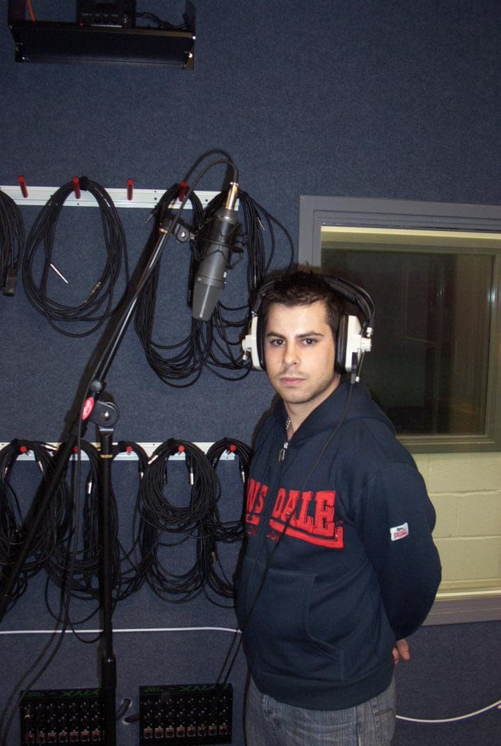 Vocalist recording in a music studio